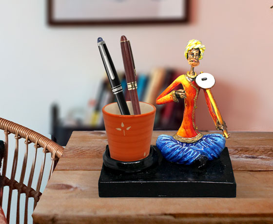 SHOWPIECE OF MALE DOTARA PLAYER MADE OF RESIN