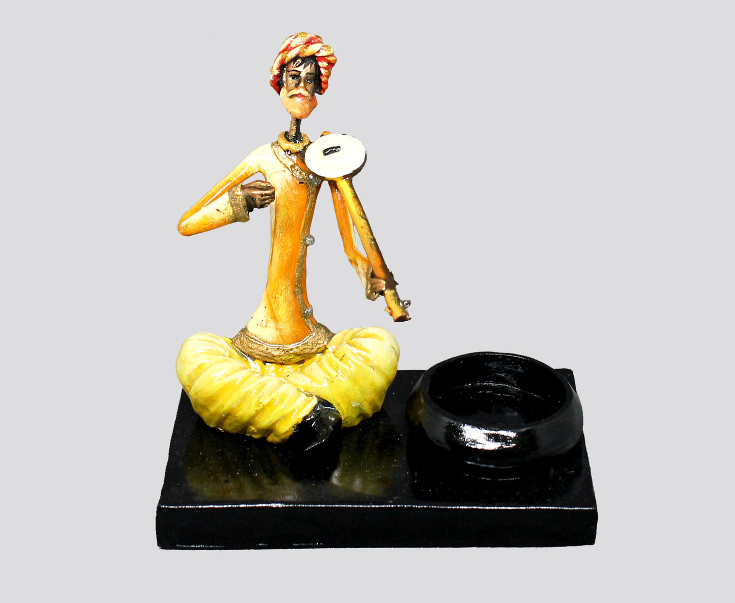 CANDLE HOLDER MALE MUSICIAN PLAYING RAVANTHA - NATURAL COLOUR SINGLE PIECE