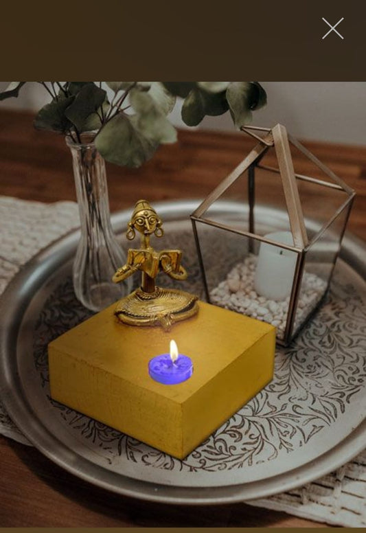 TRIBAL LADY READING WOODEN CANDLE STAND MADE OF DOKRA METAL
