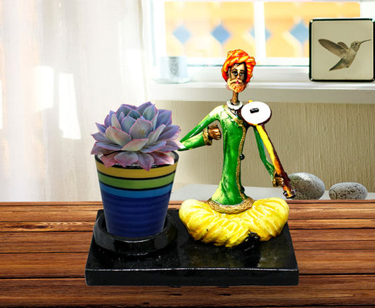 SHOWPIECE OF MALE DOTARA PLAYER MADE OF RESIN