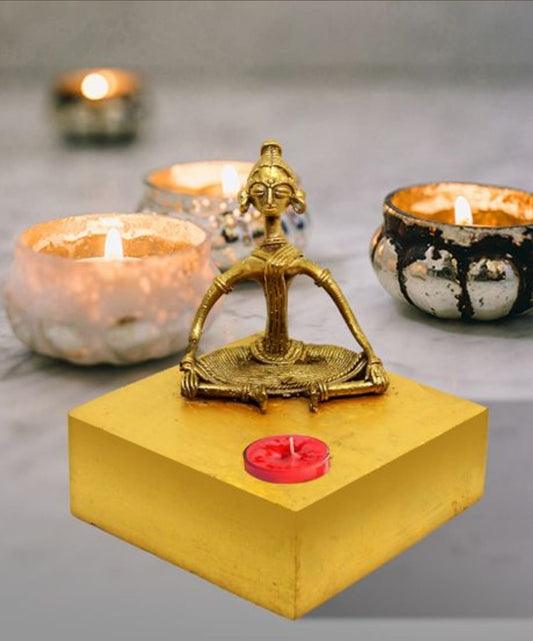 TRIBAL LADY SITTING WOODEN CANDLE STAND MADE OF DOKRA